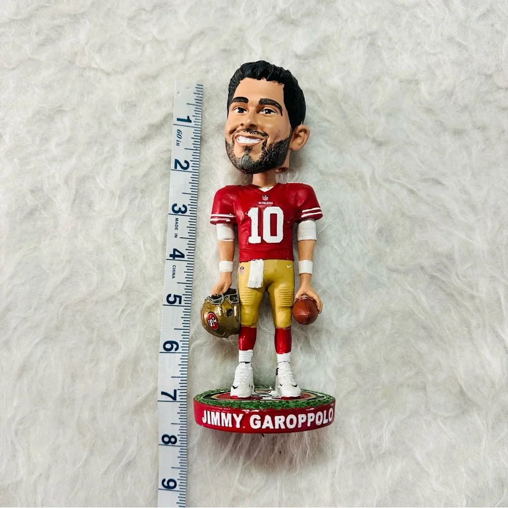 Sports-Themed Bobblehead Set - Red and White 70% good.